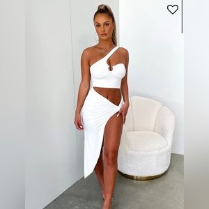 THATSSOFETCH one shoulder design with a cutout in the stomach & a slit.